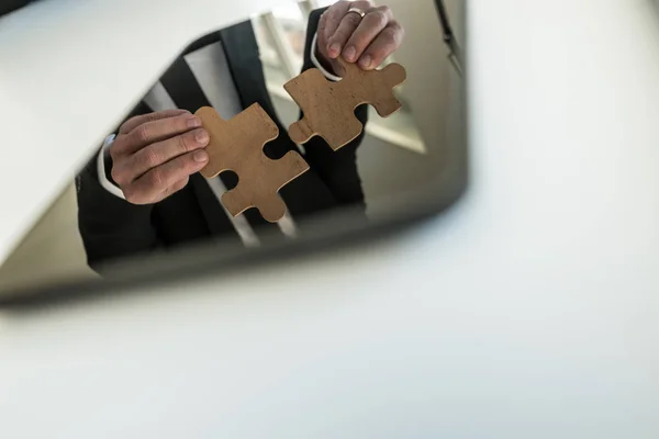 Reflection in a digital tablet of a businessman putting together — Stock Photo, Image