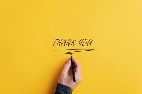 Male hand writing a Thank you sign — Stock Photo, Image