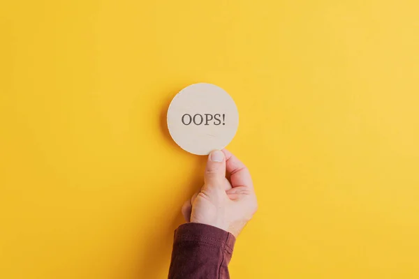 Oops sign on wooden cut circle — Stock Photo, Image