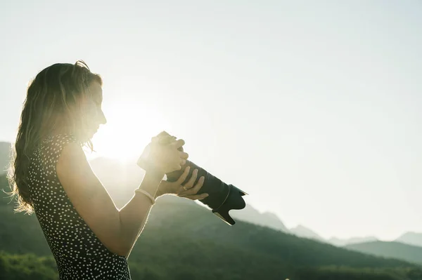 Young female photographer at sunrise — Stock Photo, Image