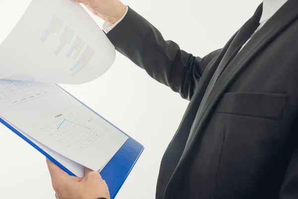 Businessman reviewing statistical report — Stock Photo, Image