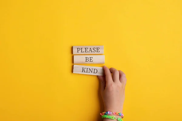 Hand Child Making Please Kind Sign Written Wooden Pegs Yellow — Stock Photo, Image