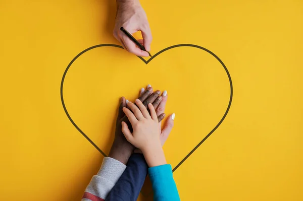Top View Man Drawing Heart Shape Stacked Hands His Family — Stock Photo, Image