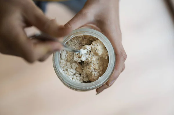 Top View Woman Feeding Sourdough Starter Yeast Flour Mixing Spoon — Stock Photo, Image