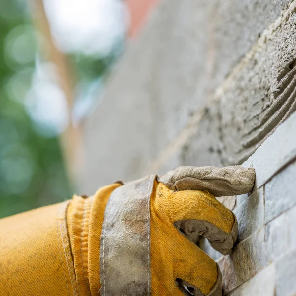 Closeup Man Pressing Ornamental Tile Glue Wall Gloved Hands Diy — Stock Photo, Image