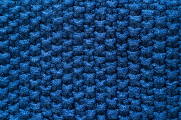 Sfondo blu scuro lavorato a maglia calda. Vestiti a maglia, maglioni, maglieria, spazio per il testo . — Foto Stock