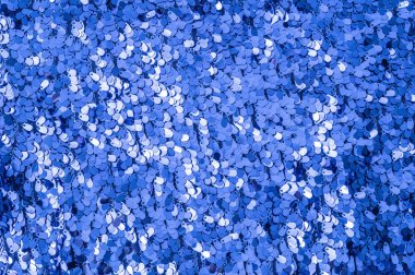 Tatil soyut ışıltı arka planı. Parlak renkli kumaş pullar. Moda kumaşı parıltısı, pullar.