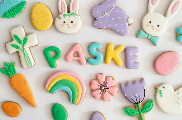 Happy Easter. Multicolored pastel easter cookies on a white background. — Stock Photo, Image