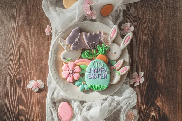 Happy Easter. Multi-colored pastel easter cookies on a wooden background. — Stock Photo, Image