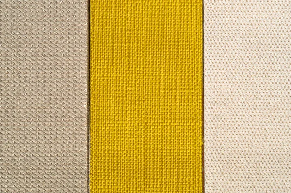 Catalogo di tessuto in tonalità giallo arancio. Campione di tessuto. Contesto industriale . — Foto Stock