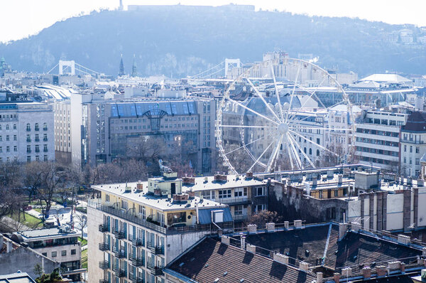 BUDAPEST, HUNGARY - MARCH 2020. Aerial view square with people in front of Saint Stephens Basilica in Budapest