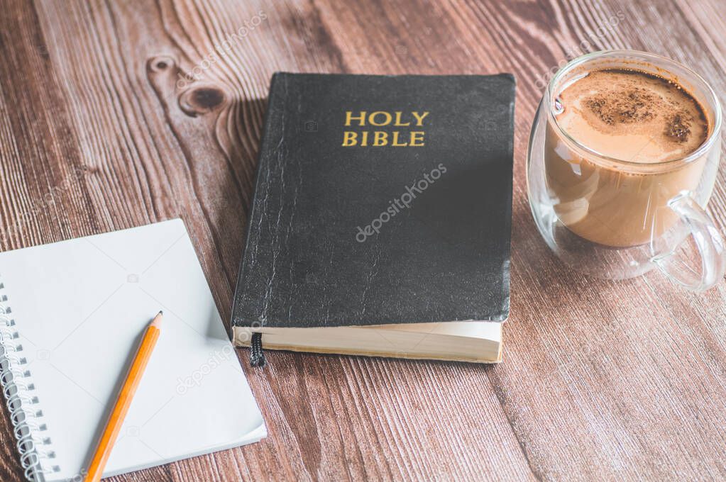 The Holy Bible with a pencil. Reading and learning the bible. Concept for faith, spirituality and religion
