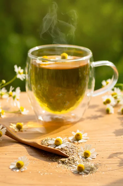 Chamomile flowers and chamomile tea. Herbal chamomile tea. Close-up.