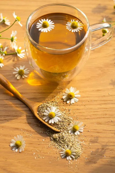 Chamomile flowers and chamomile tea. Herbal chamomile tea. Close-up.