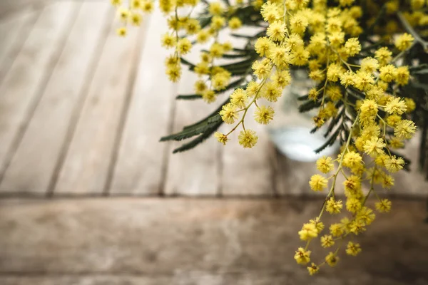 Top view on a wooden table with mimosa. Spring concept — Stock Photo, Image