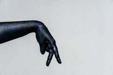 Gölge oyunu siyah eliyle Sparkles gri bir backgrou üzerinde ölüm