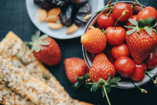 Useful snacks: strawberries, cherries, dates, almonds, breads, h