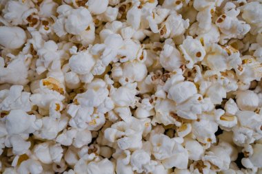 Dağıtılmış tuzlanmış patlamış mısır, doku arkaplanı.