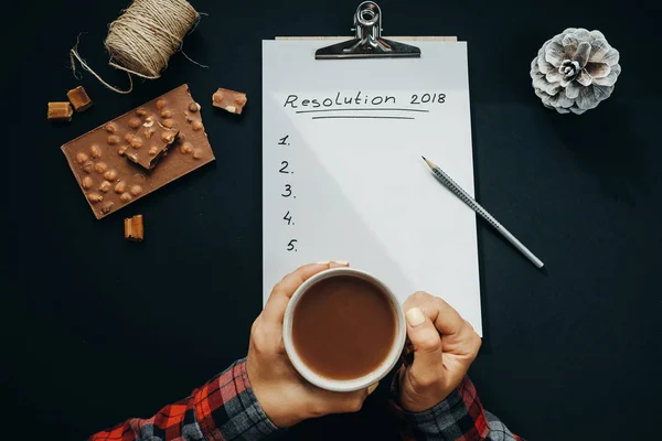 Cup of hot cocoa in woman hands and Blank album paper with New Y — Stock Photo, Image