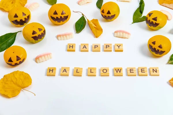 Flat lay composition Happy Halloween with fake pumpkins and tang — Stock Photo, Image
