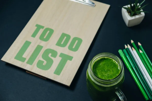 To Do List with stationery and a green smothie. Healthy break — Stock Photo, Image