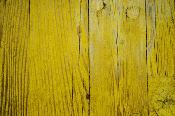 Old wooden board with yellow paint, texture. — Stock Photo, Image