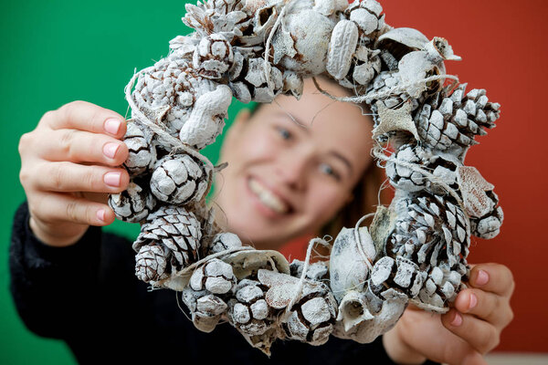 New Year's wreath in women's hands