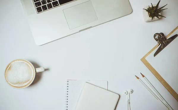 Work space with laptop, coffee and stationery on white table. To — Stock Photo, Image