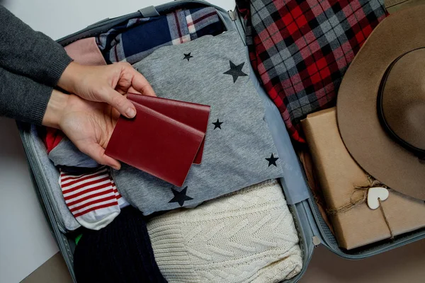 Woman Hands Passports Background Open Suitcase Packed Travelling Winter Vacations — Stock Photo, Image