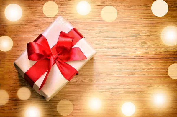 Handmade present box with red ribbon — Stock Photo, Image
