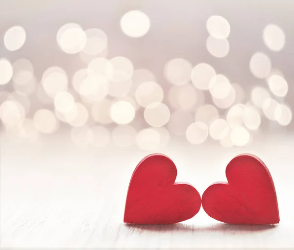 Hearts on a wooden table and background is a bokeh. — Stock Photo, Image