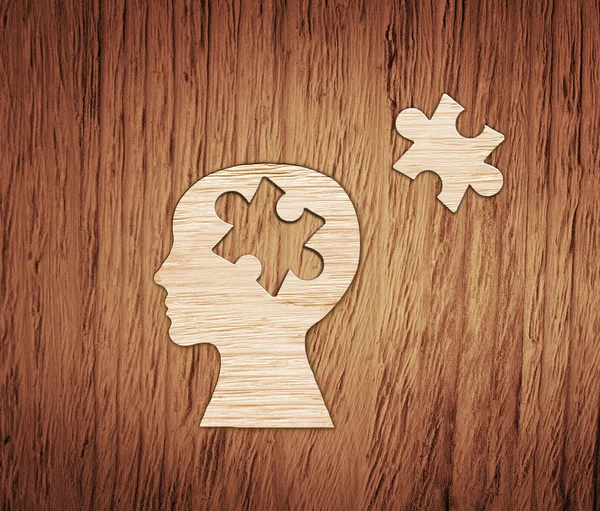 Human head profile made from brown paper with puzzle. — Stock Photo, Image