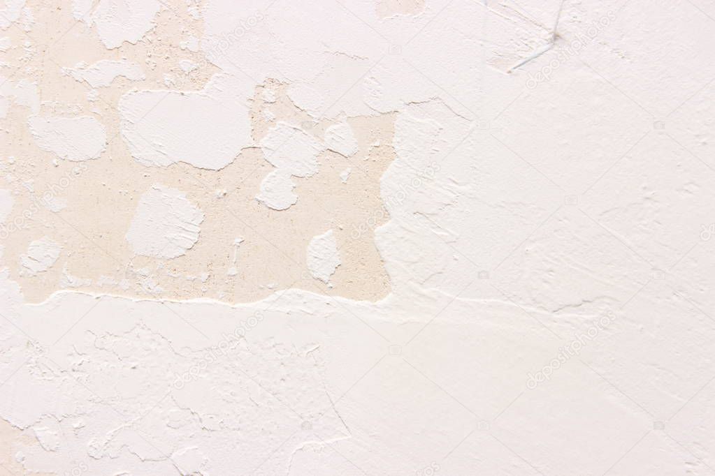 closeup surface detail of white plaster concrete wall texture background with light on top