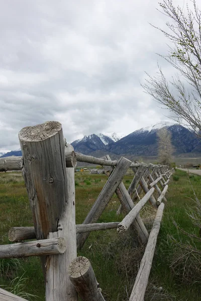 A rustic rail fence on a ranch in central Idaho\'s Lost River Mountain range.