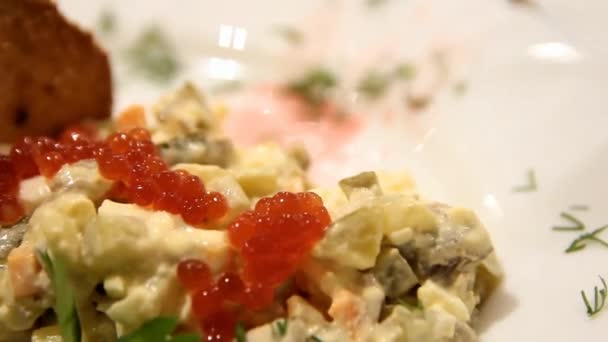Close salad plan with red caviar — Stok video