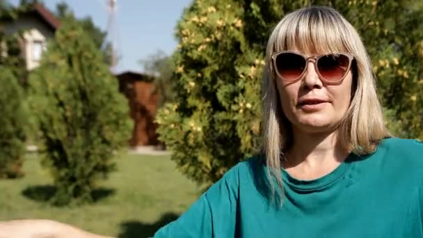 Woman Blonde Green Shirt Dances Lawn — Stok video