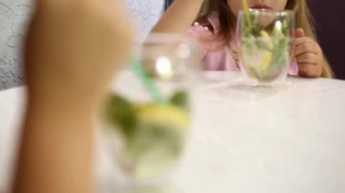 two glasses with a cooling drink on the table, change of sharpness