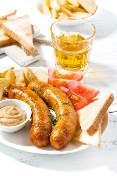 Fried sausages with potatoes, mustard and beer, vertical — Stock Photo, Image