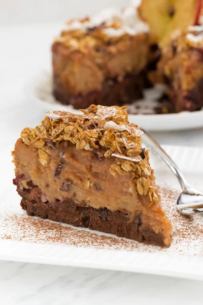 Piece of apple and caramel cake on white plate, closeup — Stockfoto