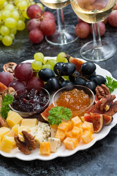 Festive appetizers - cheeses, fruits and jams, vertical — Stock Photo, Image