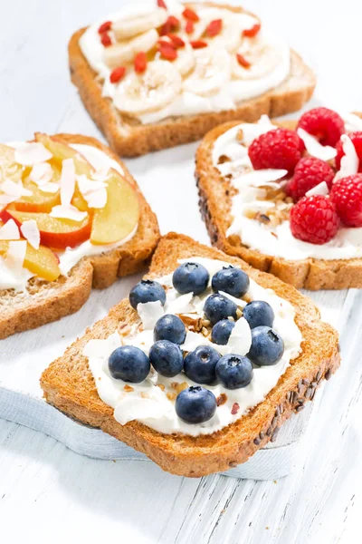 Sweet toast with different toppings, vertical — Stock Photo, Image