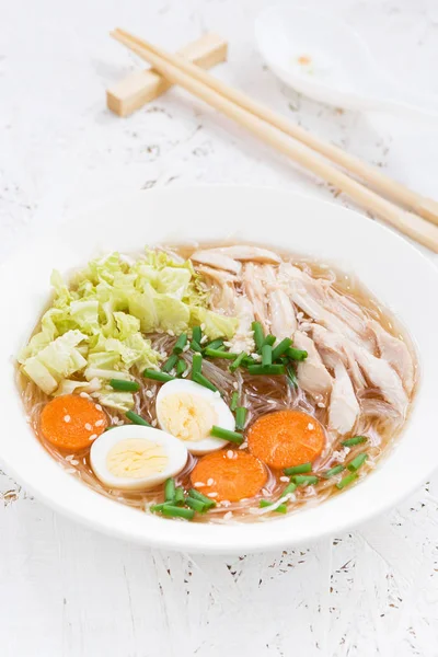 Soup with glass noodles, vegetables and chicken, vertical — Stock Photo, Image