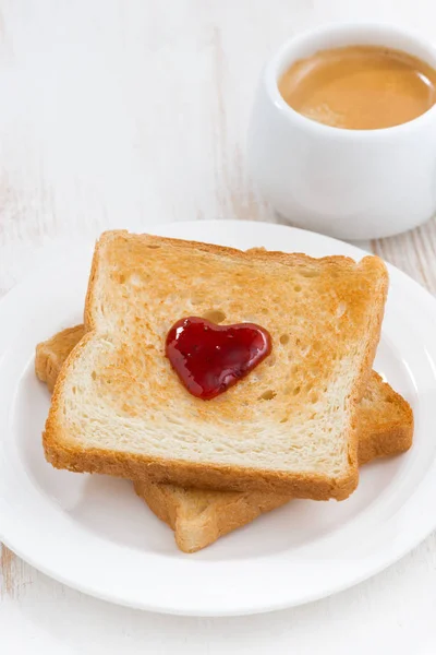 Toast with jam in the shape of a heart and coffee, top view — Stock Photo, Image