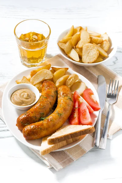 Fried sausages with potatoes, mustard and beer — Stock Photo, Image