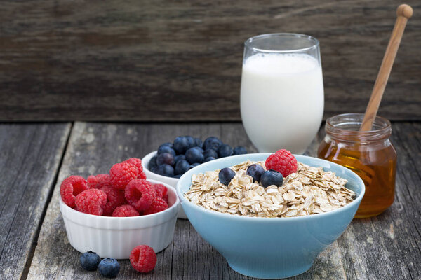 fresh breakfast products on a wooden background, horizontal