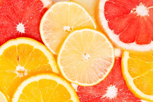 Skivor av färsk citrus, närbild ovanifrån — Stockfoto