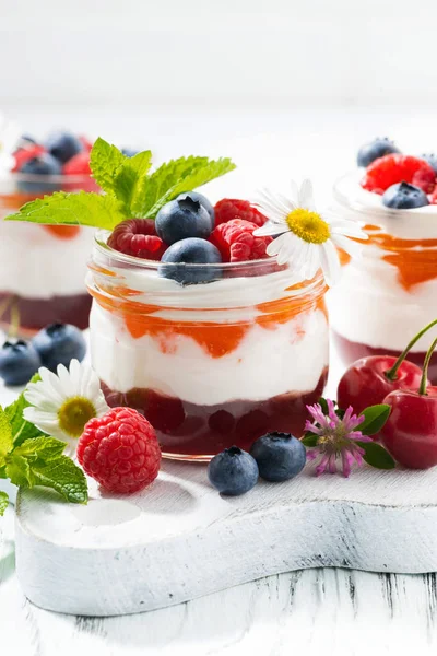 Sweet dessert with jam and cream on white board, vertical — Stock Photo, Image