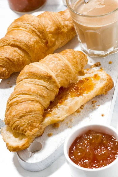 Croissants with orange jam and coffee with milk , closeup — Stock Photo, Image