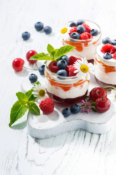 Sweet dessert with jam and cream on white wooden board, vertical — Stock Photo, Image