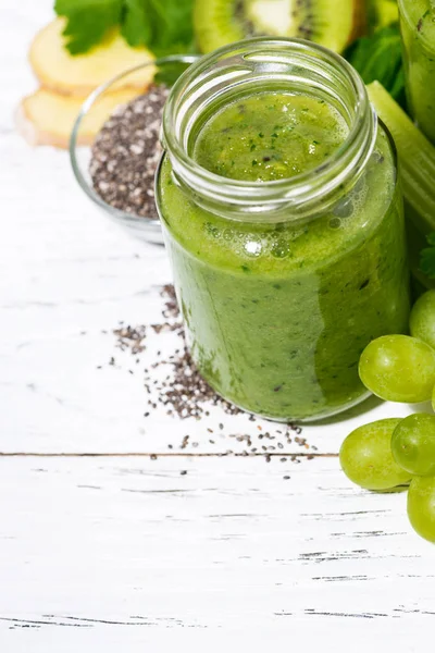 healthy green fruit and vegetable smoothies on white background